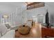 Comfortable living area offering hardwood floors, natural light, an open staircase, and easy access to the dining room at 7705 4Th W Ave, Bradenton, FL 34209