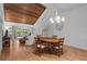 Open living room with wood ceilings, lots of natural light and an open staircase at 7705 4Th W Ave, Bradenton, FL 34209
