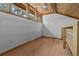 Bright loft space with wood-paneled ceiling, wood trim, and large windows letting in natural light at 7705 4Th W Ave, Bradenton, FL 34209