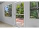 Back patio with brick and view of lush backyard at 7705 4Th W Ave, Bradenton, FL 34209