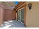 Private patio with sliding glass doors and stucco walls at 7705 4Th W Ave, Bradenton, FL 34209