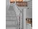 Bright white staircase leading to a loft area with wood-paneled ceiling, adding architectural interest at 7705 4Th W Ave, Bradenton, FL 34209