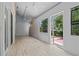 Open sunroom with tile floors and access to backyard and ample space at 7705 4Th W Ave, Bradenton, FL 34209