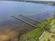 Scenic view of waterfront property, docks reaching out into the water, and lush greenery at 7705 4Th W Ave, Bradenton, FL 34209