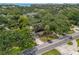 Aerial view of property showcasing mature trees, surrounding neighborhood and proximity to the water at 817 S West Shore Blvd, Tampa, FL 33609