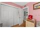 View of a bedroom closet with a full set of folding doors and a bonus nook space at 817 S West Shore Blvd, Tampa, FL 33609