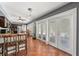Open dining area with brick flooring, ceiling fan, and white french doors at 817 S West Shore Blvd, Tampa, FL 33609