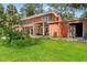 A charming two-story home with a spacious backyard and lush landscaping in a tropical setting at 817 S West Shore Blvd, Tampa, FL 33609