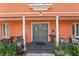 Charming front porch with columns, a double door entrance, and cozy seating, perfect for relaxing outdoors at 817 S West Shore Blvd, Tampa, FL 33609