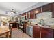 This kitchen features stainless appliances, granite countertops and tile backsplash at 817 S West Shore Blvd, Tampa, FL 33609