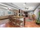 Modern kitchen featuring a breakfast bar with chairs, stainless steel appliances, open to other living areas at 817 S West Shore Blvd, Tampa, FL 33609
