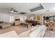 Open-concept living area with neutral decor connecting to dining and kitchen spaces at 817 S West Shore Blvd, Tampa, FL 33609