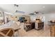 Open-concept living room with skylights, brick accent wall, and dining area at 817 S West Shore Blvd, Tampa, FL 33609