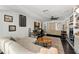 Cozy living room featuring a comfortable sofa and a decorative fireplace at 817 S West Shore Blvd, Tampa, FL 33609