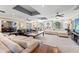 Expansive living room featuring multiple seating areas and natural light at 817 S West Shore Blvd, Tampa, FL 33609