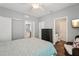 Serene bedroom offering a view of a connected kitchen and ensuite bathroom at 8410 Kenavis Pl, Odessa, FL 33556