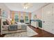 Cozy bedroom with hardwood floors, a comfortable queen-sized bed, and lots of natural light at 8410 Kenavis Pl, Odessa, FL 33556
