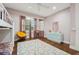 Bright bedroom with wood floors, ample natural light, and a neutral color scheme at 8410 Kenavis Pl, Odessa, FL 33556