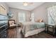 Comfortable bedroom with modern decor, stylish curtains, and a serene atmosphere at 8410 Kenavis Pl, Odessa, FL 33556