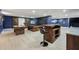 Game room features a bar, pool table, foosball table, rustic barn doors, and modern decor at 8410 Kenavis Pl, Odessa, FL 33556