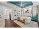 Comfortable and inviting main bedroom featuring ceiling fan, luxury carpet and furniture at 8410 Kenavis Pl, Odessa, FL 33556