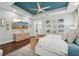 Bright and spacious main bedroom with trey ceiling, ceiling fan, and luxury furniture at 8410 Kenavis Pl, Odessa, FL 33556