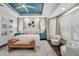 Well appointed main bedroom featuring matching night stands and a sitting area at 8410 Kenavis Pl, Odessa, FL 33556