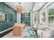 Well-appointed office with custom cabinetry, large windows, and elegant decor at 8410 Kenavis Pl, Odessa, FL 33556
