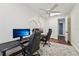 Spacious office with hardwood floors, multiple workstations, and ample natural light, ideal for productivity at 8410 Kenavis Pl, Odessa, FL 33556