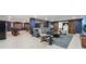 Relax in this rec room with a bar, pool table, and entertainment area at 8410 Kenavis Pl, Odessa, FL 33556