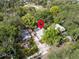 This is an aerial view of a home with a quaint yard surrounded by lush, mature trees at 844 10Th S Ave, St Petersburg, FL 33701