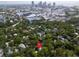 Aerial view of neighborhood with lush trees and distant city skyline backdrop at 844 10Th S Ave, St Petersburg, FL 33701