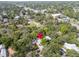 An aerial view captures a home in a tree-filled lot, near town, showcasing it's peaceful charm at 844 10Th S Ave, St Petersburg, FL 33701