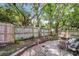Landscaped backyard featuring a gravel area with chairs and a wooden fence at 844 10Th S Ave, St Petersburg, FL 33701