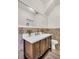 Stylish bathroom with a modern vanity, white countertop, and neutral-toned tile backsplash at 844 10Th S Ave, St Petersburg, FL 33701