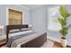 Bedroom with a stylish upholstered bed, side tables, and natural light at 844 10Th S Ave, St Petersburg, FL 33701
