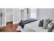 A bedroom featuring hardwood floors and a partially-visible doorway leading to another room at 844 10Th S Ave, St Petersburg, FL 33701
