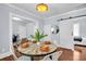Dining area with rustic table next to a sliding door; a living room is visible through an open doorway at 844 10Th S Ave, St Petersburg, FL 33701
