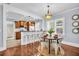 An open-concept dining area flows seamlessly into a kitchen with a breakfast bar and natural light at 844 10Th S Ave, St Petersburg, FL 33701