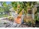 Quaint yellow house with inviting front porch and well-manicured landscaping at 844 10Th S Ave, St Petersburg, FL 33701