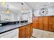 Spacious kitchen featuring dark countertops, stainless steel appliances, and ample wooden cabinet space at 844 10Th S Ave, St Petersburg, FL 33701