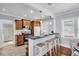 Modern kitchen featuring wooden cabinets, a breakfast bar with stools, and stainless steel appliances at 844 10Th S Ave, St Petersburg, FL 33701