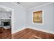 Living room features hardwood floors and a fireplace with stone surround at 844 10Th S Ave, St Petersburg, FL 33701