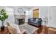 Inviting living room with a fireplace, hardwood floors, and large windows, offering ample light at 844 10Th S Ave, St Petersburg, FL 33701