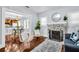 Cozy living room featuring a decorative fireplace, hardwood floors, and an open layout at 844 10Th S Ave, St Petersburg, FL 33701