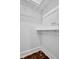 A simple white walk-in closet with painted white walls and shelving at 844 10Th S Ave, St Petersburg, FL 33701