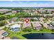 Aerial view showing home with screened pool, waterfront location, and proximity to local amenities at 8521 30Th E St, Parrish, FL 34219
