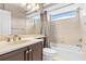 Bright bathroom with vanity sink, mirror, tiled walls, and a bathtub with shower at 8521 30Th E St, Parrish, FL 34219