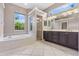 Bright bathroom featuring a soaking tub, walk-in shower, and double vanity at 8521 30Th E St, Parrish, FL 34219