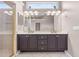 Bathroom with a spacious double vanity and modern lighting fixtures at 8521 30Th E St, Parrish, FL 34219